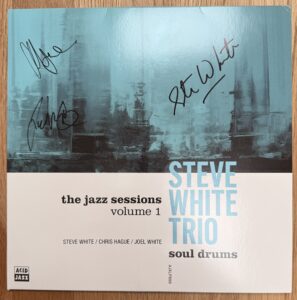 Cover artwork, signed, of the Steve White Trio debut album, 'Soul Drums, released on Acid Jazz Records, a live performance of which was reviewed by Joanna Long of Echoes In Ink