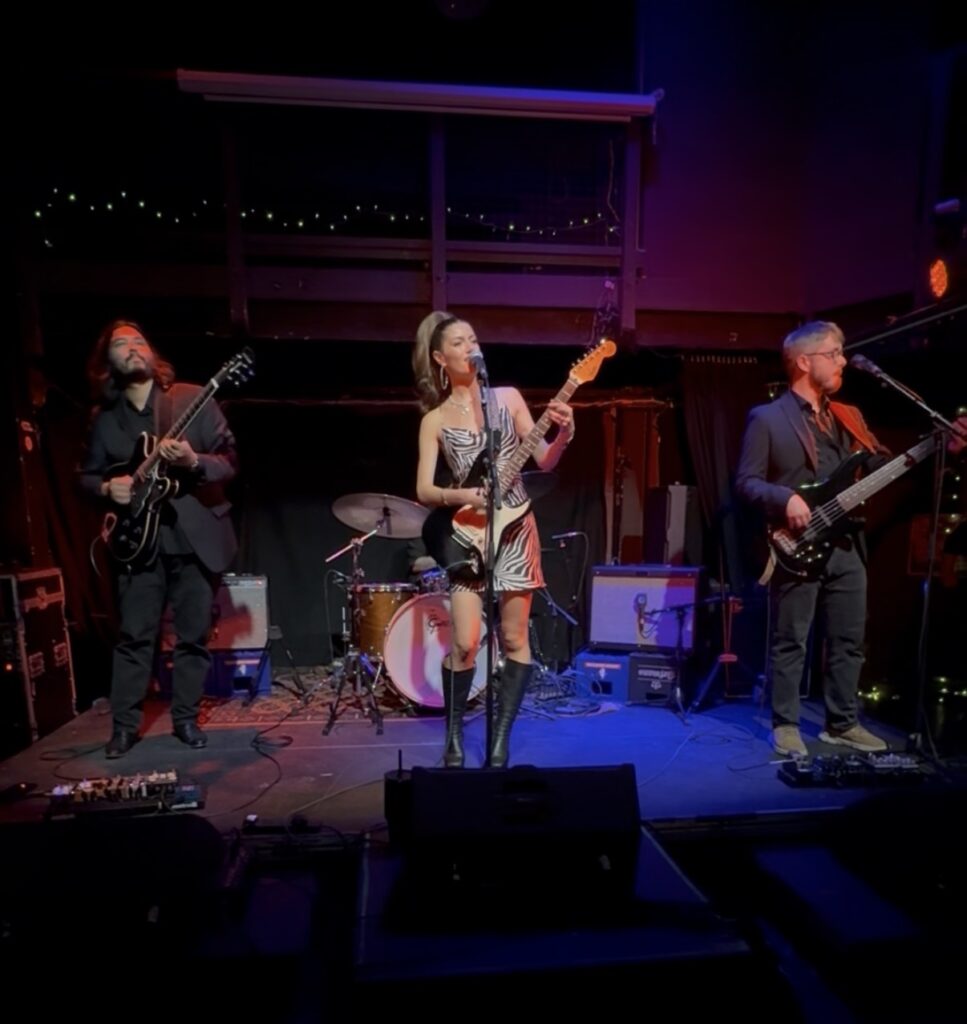 Photo of Lucca Mae watchign her band from the audience during her set at The Cluny in Newcastle September 2026